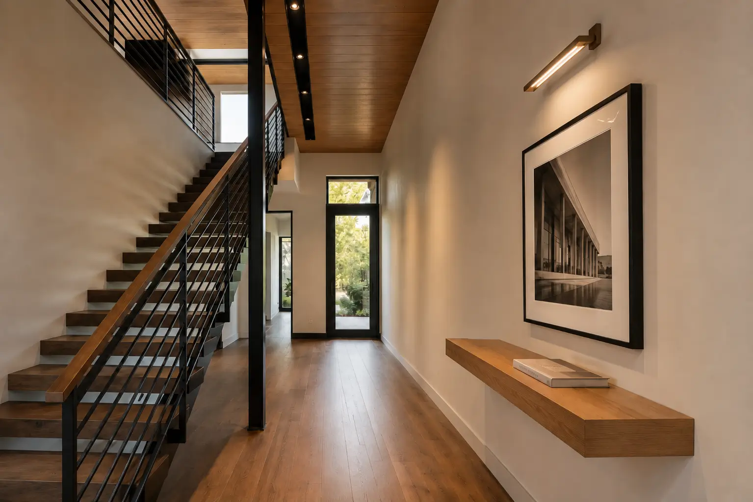 A code-compliant modern hallway demonstrating verified 36-inch clear walking width, proportional runner margins, and 2700K layered lighting