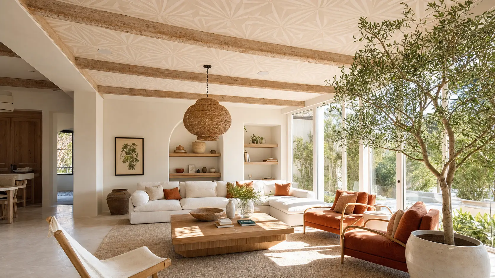 A living room with a wallpapered statement ceiling and warm wood beams
