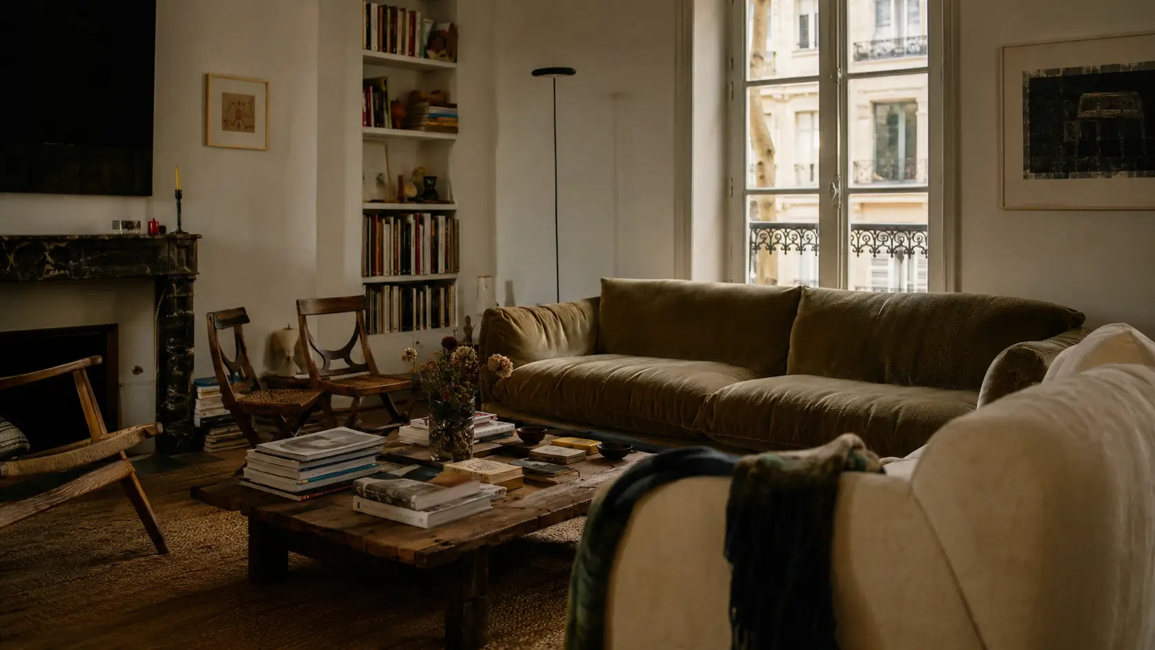 Warm minimalist living room featuring warm white walls, oatmeal wool rug, and natural oak furniture